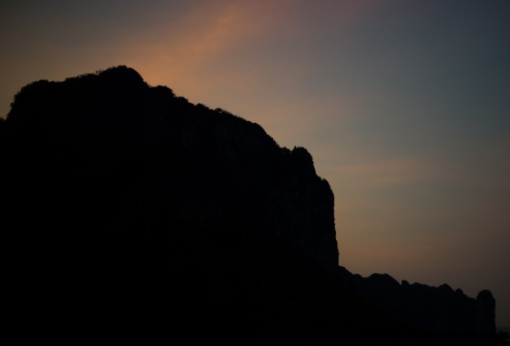 dawn glow behind the cliff in Aonang
