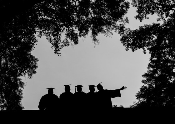 Graduates posing in the scenic surrounds